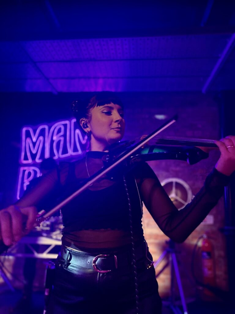 Sophia Dignam Manchester session viola player playing electric violin live at club venue